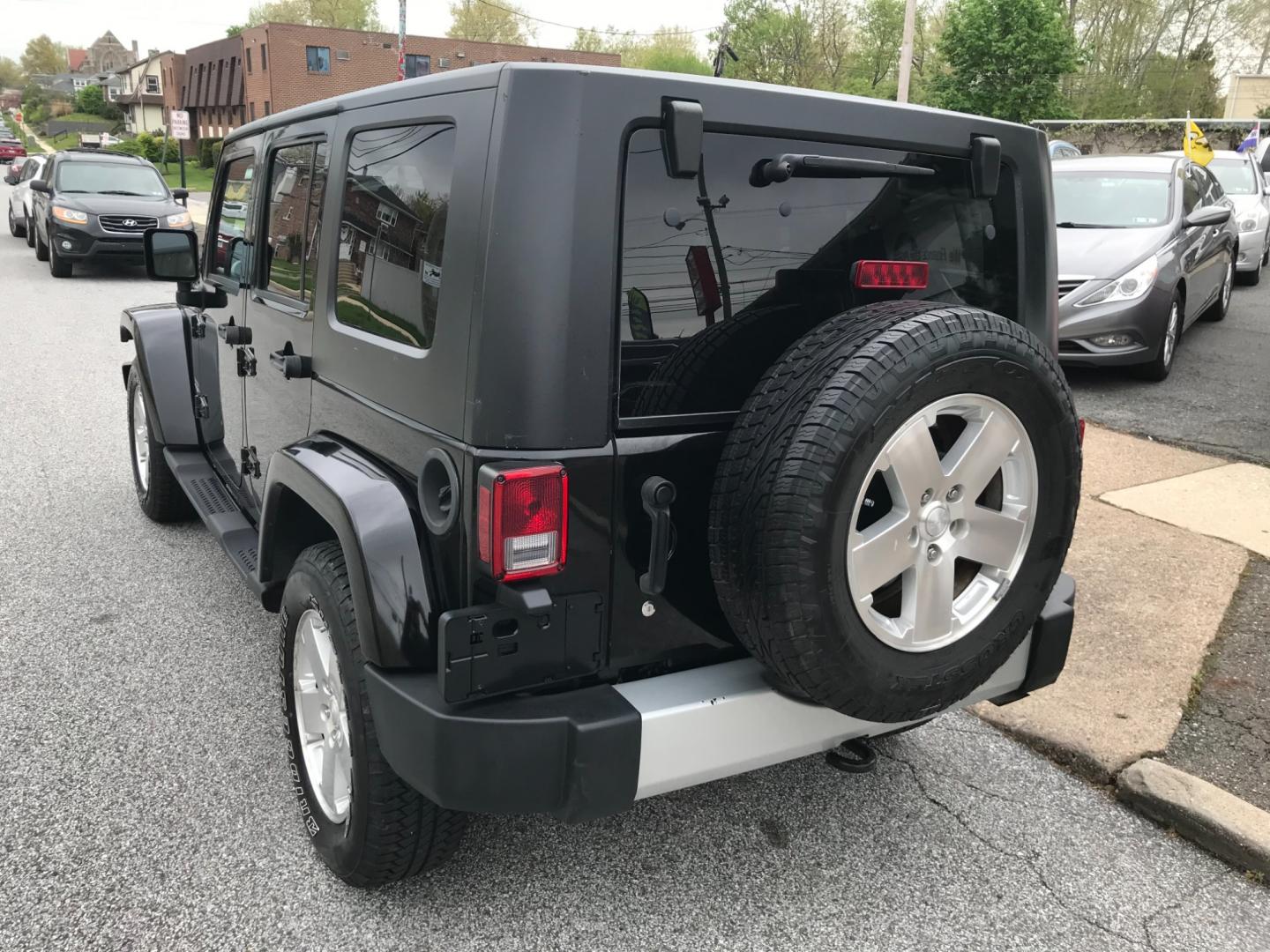 2008 Black /Black Jeep Wrangler Unlimited Sahara 4WD (1J8GA59198L) with an 3.8L V6 OHV 12V engine, Automatic transmission, located at 577 Chester Pike, Prospect Park, PA, 19076, (610) 237-1015, 39.886154, -75.302338 - Photo#6